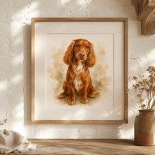 A framed watercolor-style personalised portrait print of a reddish-brown dog with a white chest, displayed on a wooden surface against a white textured wall. A rustic brown vase with dried stems sits to the right, and a folded cream textile is at the lower left. Personalised watercolour dog portrait print in, custom pet gift, 5 x 5", 6 x 6", 6x4", 6.5 x 4.5", 7x5", 5 x 3.5", 8 x 6", 10 x 8", 12 x 8",  12 x 12", 17.5 x 12", 23.5 x 15.5", 29.5" x 19.5"