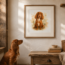 A framed watercolor-style portrait of a reddish-brown dog hanging on a textured white wall in a rustic room. A real dog sits at the lower left looking up at the framed artwork.